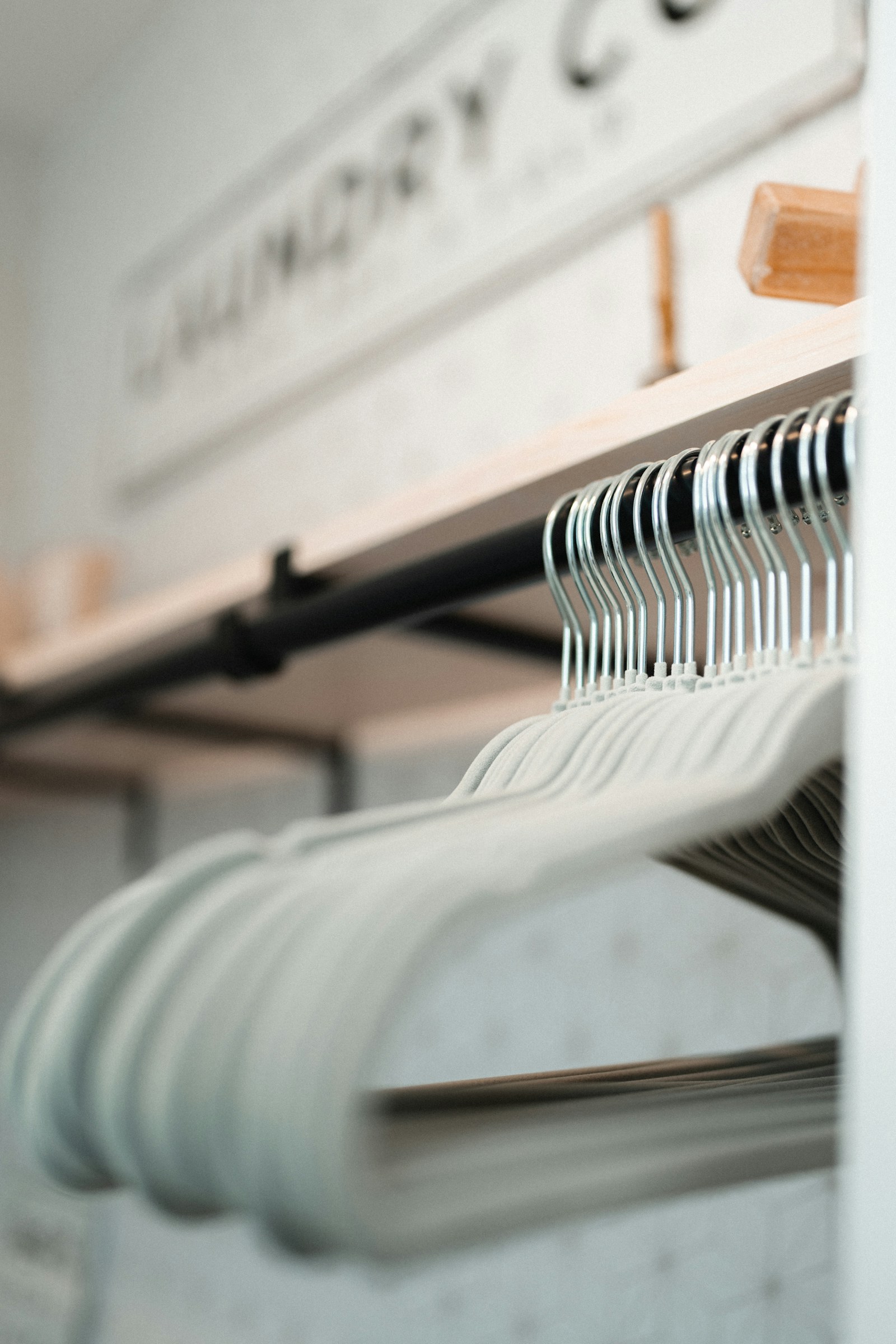 Fresh garments on hangers ready for professional dry-cleaning care